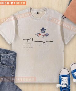 Excited fan wearing a washed T-shirt featuring top Toronto Blue Jays, Maple Leafs, and Buffalo Bills logos.