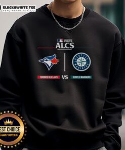 Top Toronto Blue Jays vs Seattle Mariners 2025 ALCS game day sweatshirt featuring team logos and vibrant design.