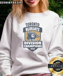 Alt Text: Cozy sweatshirt featuring the 2025 AL East Division Champions logo for the Toronto Blue Jays. Perfect for fans!