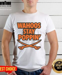 Alt Text: Funny football t-shirt featuring Top Wahoos Stay Poppin design, perfect for game day and sports enthusiasts.