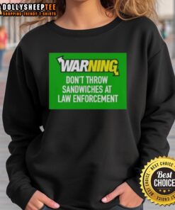 Top warning sweatshirt: 'Don't throw sandwiches at law enforcement' design, featuring a bold graphic and humorous message.