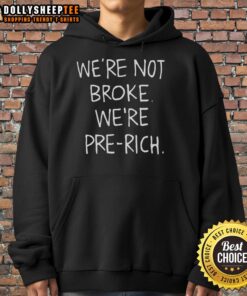 Alt Text: Stylish 'Top We're Not Broke, We're Pre-Rich' hoodie displayed on a hanger, showcasing trendy streetwear fashion.