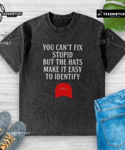Alt Text: MAGA red hat washed t-shirt with humorous text 'You Can't Fix Stupid' designed for casual wear and political statement.