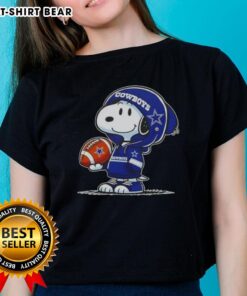 Snoopy in a Dallas Cowboys hoodie smiles at fans on a ladies tee, showcasing awesome peanuts character design.