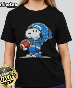 Snoopy in a Detroit Lions hoodie smiling at fans, featured on an awesome ladies tee with peanuts design.