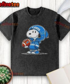 Snoopy in a hoodie, smiling at fans on a washed Detroit Lions t-shirt, showcasing awesome Peanuts character design.