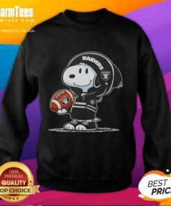 Alt Text: Snoopy in a hoodie with Las Vegas Raiders logo, smiling at fans while wearing an Awesome Peanuts sweatshirt.