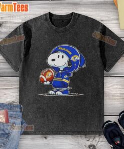 Snoopy wearing a Los Angeles Rams hoodie smiles at fans on a washed t-shirt, showcasing awesome peanuts design.