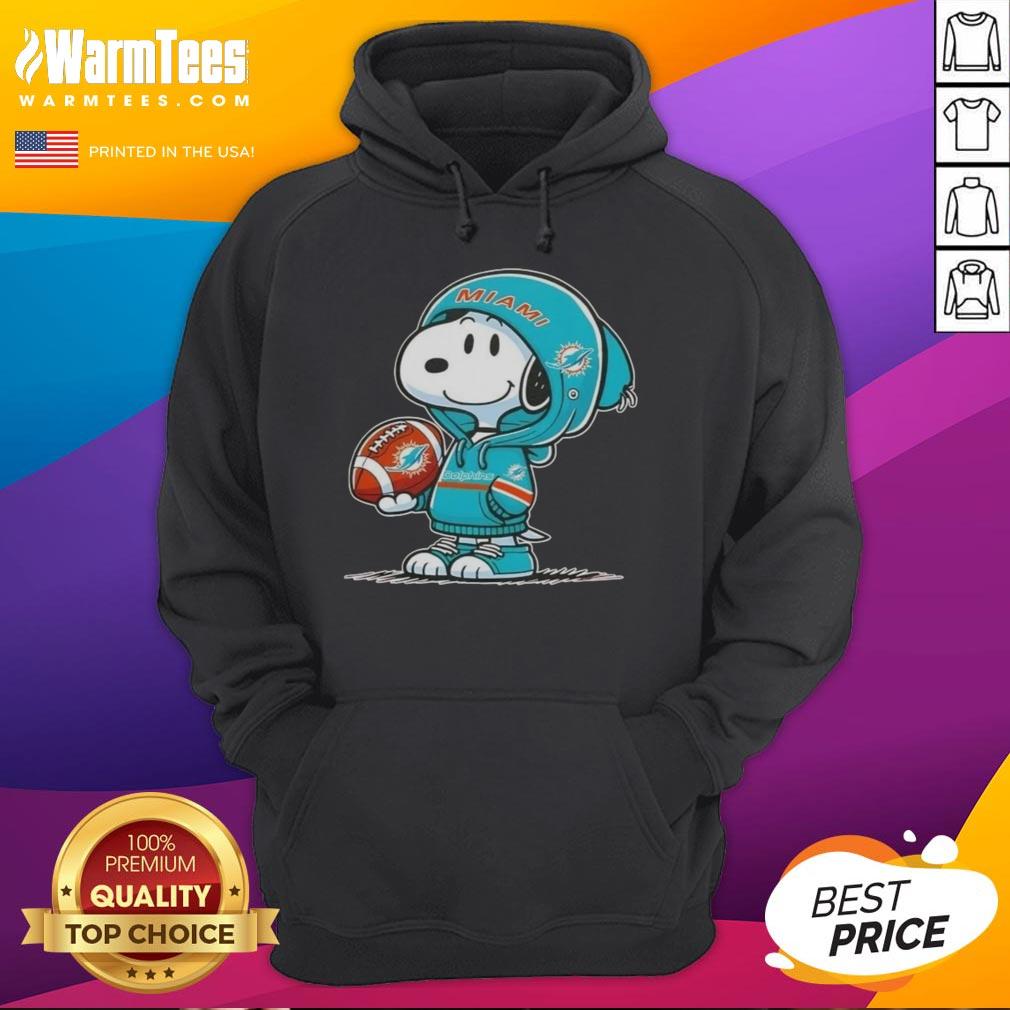 awesome-peanuts-snoopy-wearing-hoodie-miami-dolphins-and-smilling-at-fans-hoodie Snoopy in a Miami Dolphins hoodie, smiling at fans, showcasing awesome Peanuts character style and team spirit.