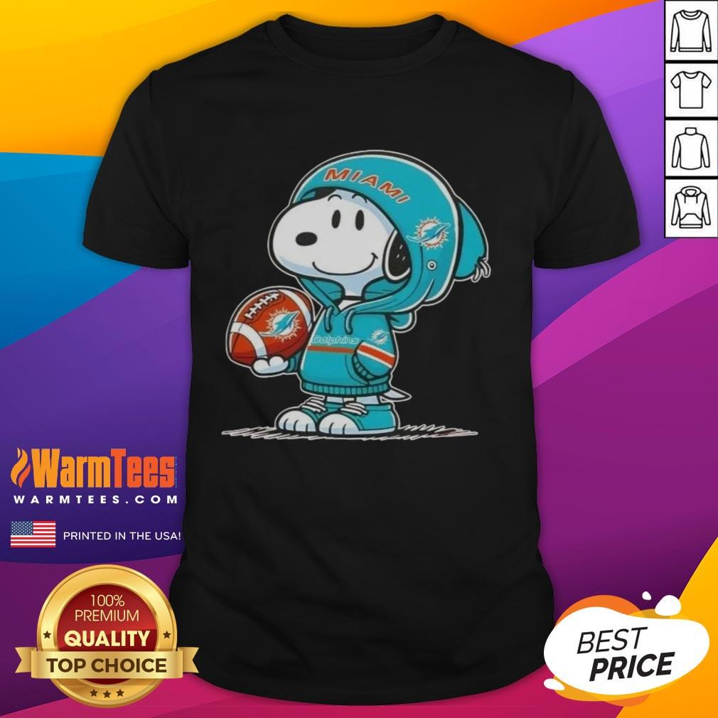awesome-peanuts-snoopy-wearing-hoodie-miami-dolphins-and-smilling-at-fans-t-shirt Alt Text: Snoopy in a Miami Dolphins hoodie smiles at fans on a vibrant t-shirt featuring Awesome Peanuts design.