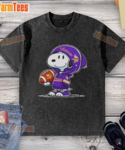 Alt Text: Snoopy wearing a Minnesota Vikings hoodie smiles at fans on a stylish washed T-shirt celebrating Awesome Peanuts.