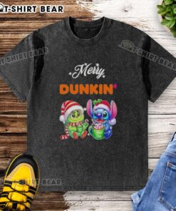 Alt Text: Cute Baby Grinch and Stitch graphic on a Dunkin' Merry Christmas washed t-shirt, perfect for festive celebrations.