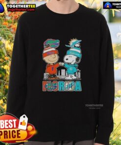 Alt Text: Cute Charlie Brown and Snoopy sweatshirt featuring Florida Gators and Miami Dolphins skyline design.