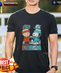 Alt Text: Cute Charlie Brown and Snoopy T-shirt featuring Florida Gators and Miami Dolphins skyline design.