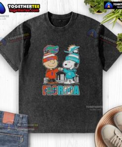 Alt Text: Cute Charlie Brown and Snoopy graphic on a Florida Gators and Miami Dolphins skyline washed t-shirt.