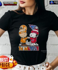 Alt Text: Cute Charlie Brown and Snoopy graphic on Tennessee Vols x Titans skyline ladies tee shirt design.