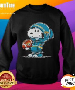 Cute Peanuts Snoopy wearing a Jacksonville Jaguars hoodie, smiling at fans in a cozy sweatshirt.