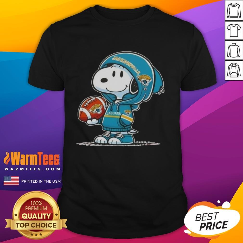 cute-peanuts-snoopy-wearing-hoodie-jacksonville-jaguars-and-smilling-at-fans-t-shirt Alt Text: Cute Peanuts Snoopy in a Jacksonville Jaguars hoodie, smiling at fans on a fun T-shirt design.