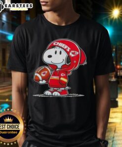Alt Text: Cute Peanuts Snoopy in a Kansas City Chiefs hoodie, smiling at fans on a fun T-shirt design.