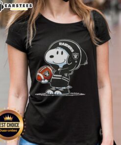 Alt Text: Cute Peanuts Snoopy in a hoodie, smiling at fans, wearing a Las Vegas Raiders tee, perfect for ladies.
