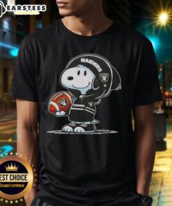 Alt Text: Cute Peanuts Snoopy in a hoodie featuring Las Vegas Raiders, smiling at fans on a trendy T-shirt.