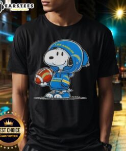 Alt Text: Cute Peanuts Snoopy in a hoodie, smiling at fans, wearing Los Angeles Chargers T-shirt, perfect for NFL fans.