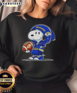 Alt Text: Cute Peanuts Snoopy wearing Los Angeles Rams hoodie, smiling at fans, showcasing a fun sweatshirt design.