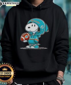 Alt Text: Cute Peanuts Snoopy wearing Miami Dolphins hoodie, smiling at fans, showcasing team spirit and playful charm.