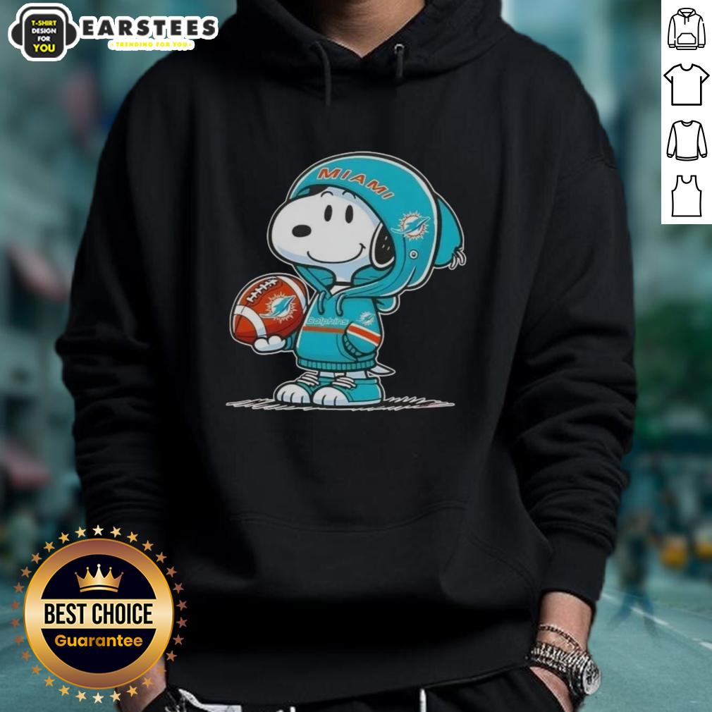 cute-peanuts-snoopy-wearing-hoodie-miami-dolphins-and-smilling-at-fans-hoodie Alt Text: Cute Peanuts Snoopy wearing Miami Dolphins hoodie, smiling at fans, showcasing team spirit and playful charm.