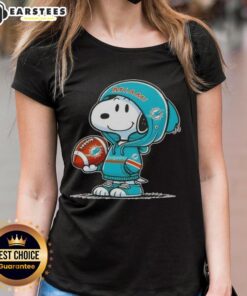 Cute Peanuts Snoopy wearing a Miami Dolphins hoodie, smiling at fans on a ladies tee design.