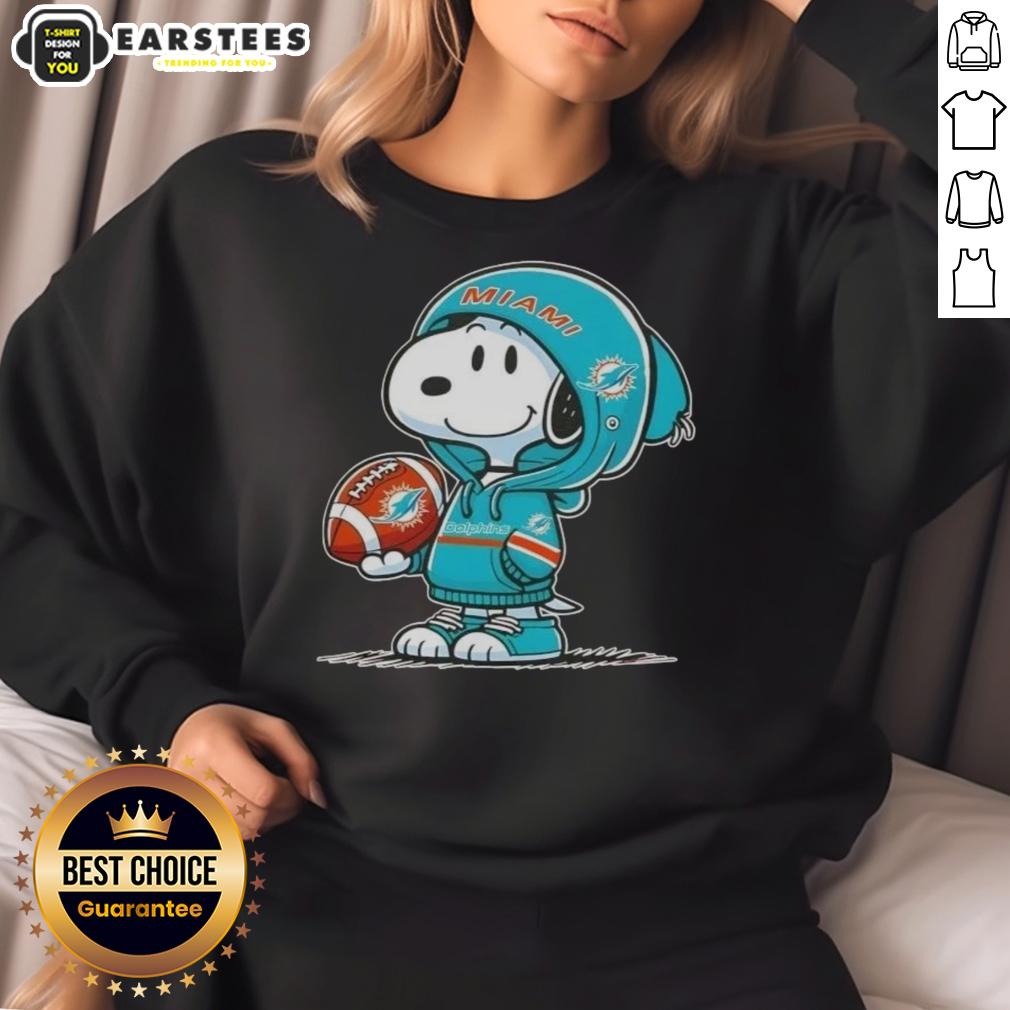 cute-peanuts-snoopy-wearing-hoodie-miami-dolphins-and-smilling-at-fans-sweatshirt Cute Peanuts Snoopy wearing Miami Dolphins hoodie, smiling at fans in a colorful sweatshirt.