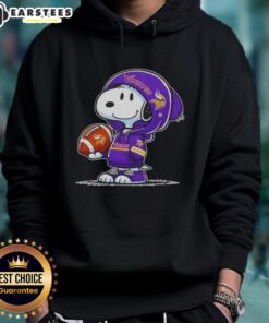 Alt Text: Cute Peanuts Snoopy in Minnesota Vikings hoodie smiling at fans, showcasing team spirit and adorable charm.
