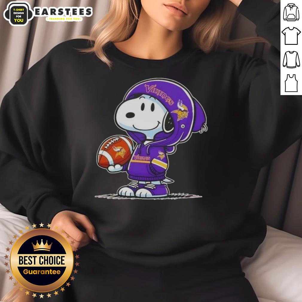 cute-peanuts-snoopy-wearing-hoodie-minnesota-vikings-and-smilling-at-fans-sweatshirt Alt Text: Cute Snoopy wearing a Minnesota Vikings hoodie, smiling at fans while showcasing a cozy sweatshirt design.