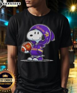 Alt Text: Cute Peanuts Snoopy in a Minnesota Vikings hoodie smiling at fans on a stylish T-shirt design.