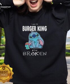 Cute Stitch sweatshirt with 'I work at Burger King I'm broken' text, perfect for casual wear and Disney fans.