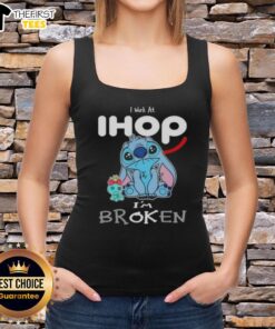 Cute Stitch tank top saying 'I work at IHOP, I'm broken' perfect for fans of Disney and casual wear.