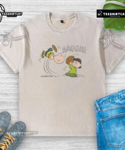 Funny Peanuts Lucy van Pelt Aaugh graphic on a washed t-shirt, showcasing her iconic expression and vibrant colors.