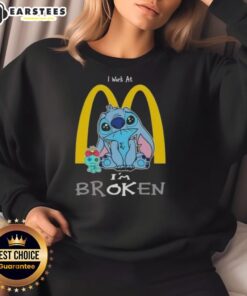 Funny Stitch I Work At McDonald's I'm Broken sweatshirt design featuring a playful graphic and vibrant colors.