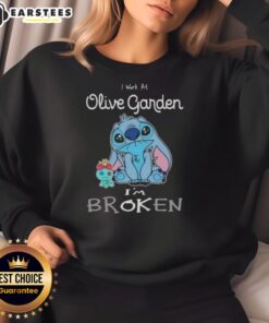 Funny Stitch sweatshirt featuring 'I work at Olive Garden, I'm broken' design, perfect for restaurant humor lovers.