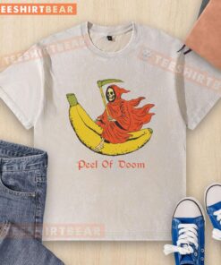 Funny The Reaper Banana Peel of Doom washed t-shirt featuring a humorous graphic design of a grim reaper slipping on a banana peel.