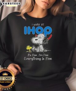 Funny Snoopy and Woodstock sweatshirt with 'I work at IHOP, it's fine, I'm fine, everything is fine' text design.