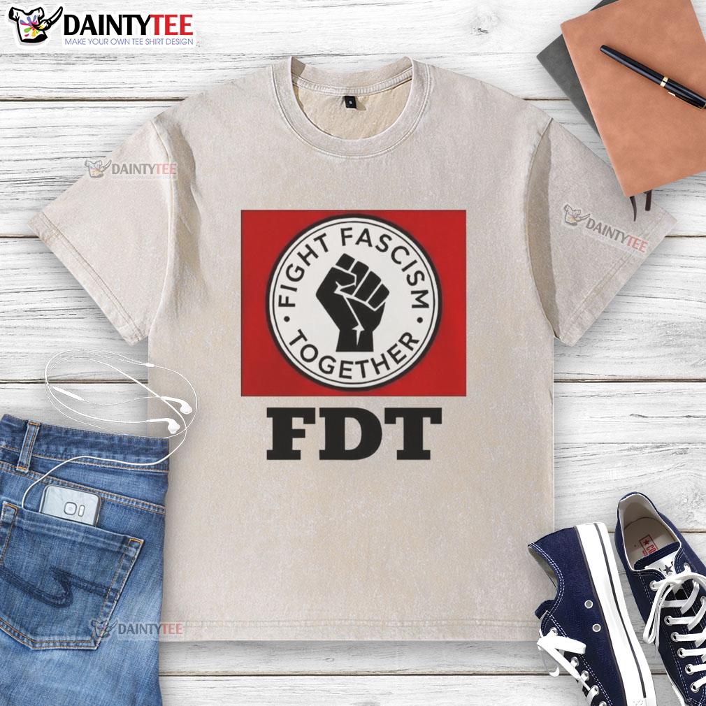 good-fight-fascism-together-logo-washed-t-shirt Alt Text: Good Fight Fascism Together logo on a washed t-shirt, promoting unity and activism against fascism.
