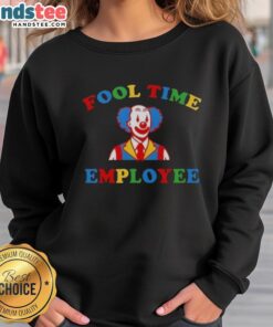 Employee wearing a colorful clown sweatshirt from Good Fool Time, showcasing a fun and vibrant work culture.