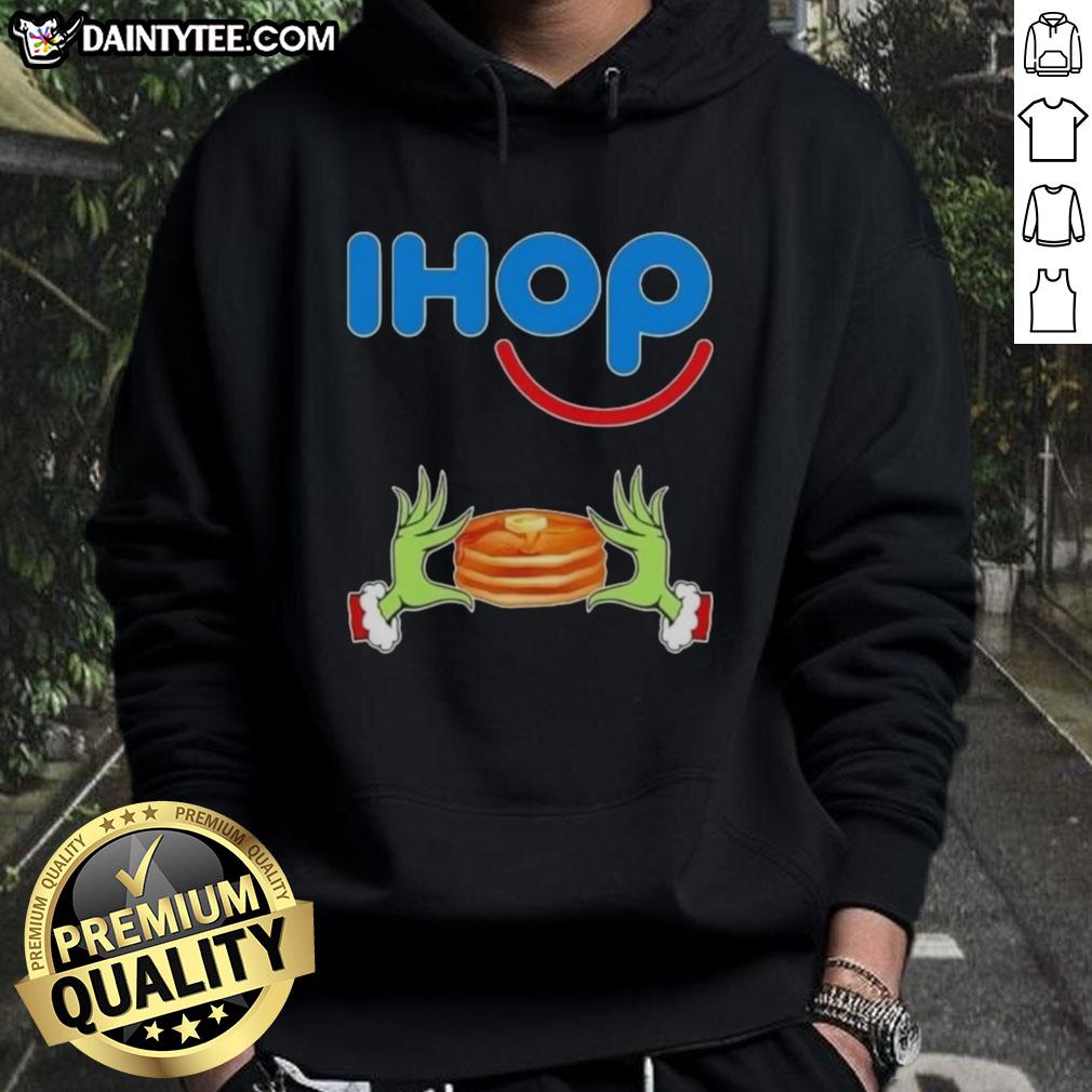 good-grinch-hands-love-ihop-merry-christmas-hoodie Good Grinch hands holding a mug, wearing a Merry Christmas IHOP hoodie in festive colors.
