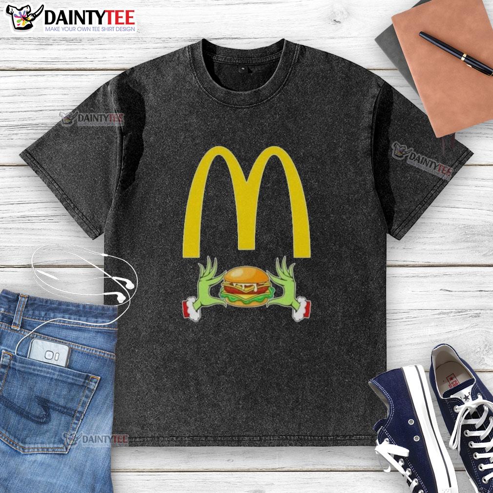 good-grinch-hands-love-mcdonalds-merry-christmas-washed-t-shirt Good Grinch hands holding a McDonald's meal, wearing a Merry Christmas washed t-shirt, festive holiday spirit.