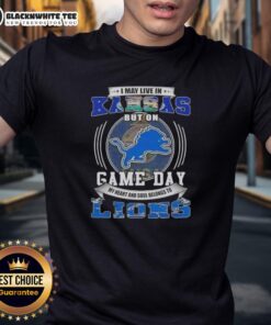 Good I May Live In Kansas But On Game Day Detroit Lions Football T-Shirt showcasing team spirit and fan pride.