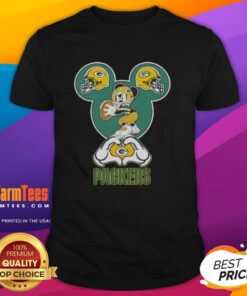 Good Mickey hands forming a heart on a Green Bay Packers football T-shirt, perfect for fans and game day attire.