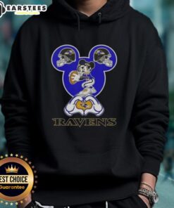 Alt Text: Good Mickey hands forming a heart, wearing a Baltimore Ravens football hoodie, showcasing love for the team.