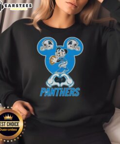 Good Mickey hands forming a heart on a Carolina Panthers football sweatshirt, showcasing team spirit and love.