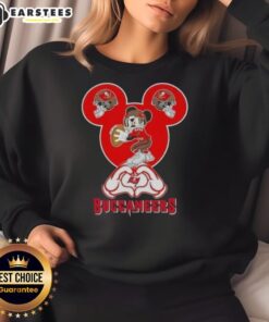 Good Mickey hands forming a heart in a Tampa Bay Buccaneers football sweatshirt, showcasing team spirit and love.